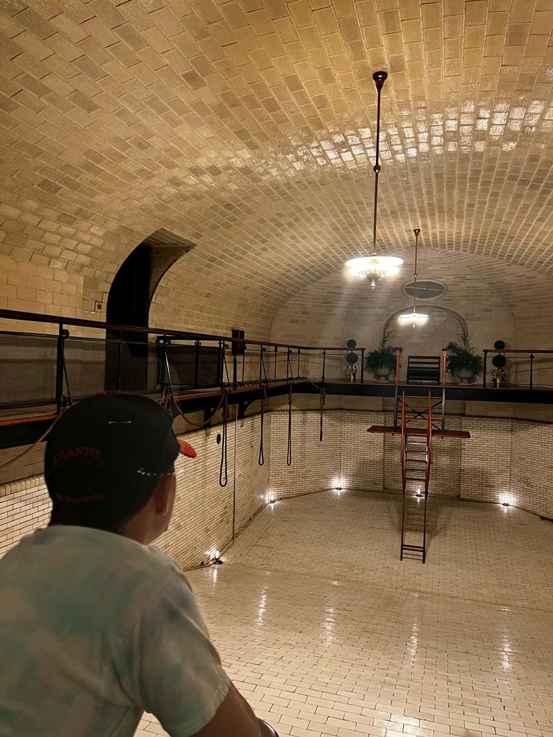 A young boy looks at the pristine estate pool at the Biltmore.