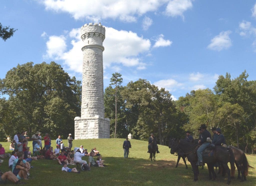 Onlookers enjoy a Civil War reenactment near Wilders Brigade at the Chickamauga Battlefield, one of the best things to do in Chattanooga with kids.