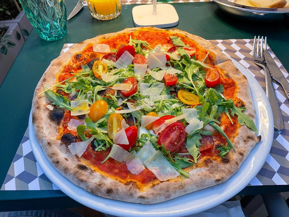A colorful pizza at a restaurant in Ostuni, knowing a few food tips is one of the essential tips for visiting Puglia with kids.