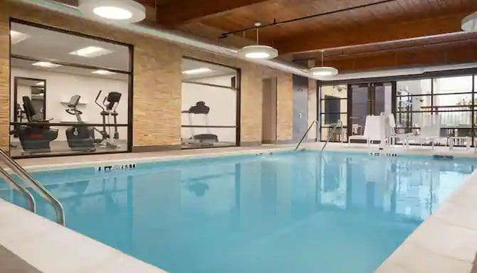 The indoor pool, with nearby fitness center, at the Country Inn & Suites, Asheville River Arts District, one of the best hotels in Asheville for families.