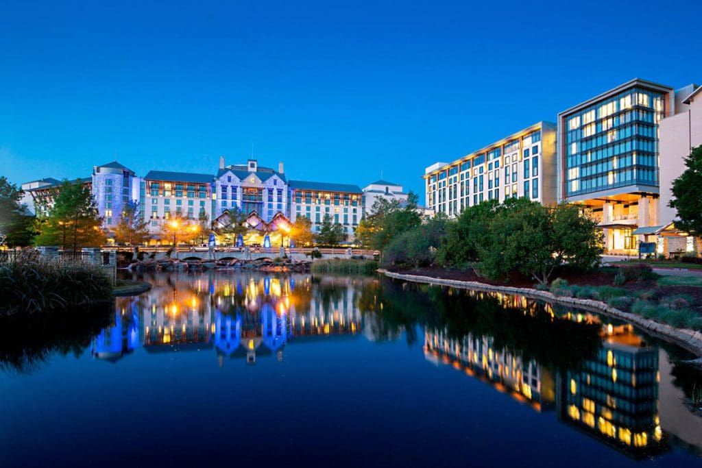 The exterior entrance to Gaylord Texan Resort & Convention Center, across a large on-site pond, one of the best hotels in Dallas for families.