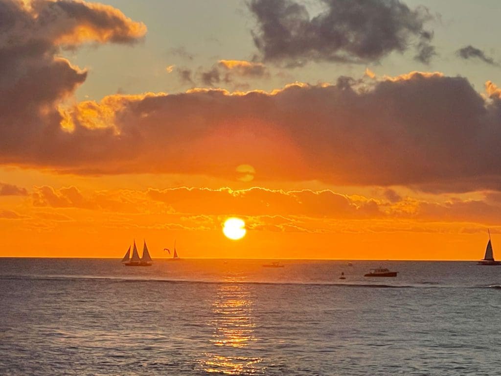 A stunning sunset in brilliant orange over the ocean in Key West.