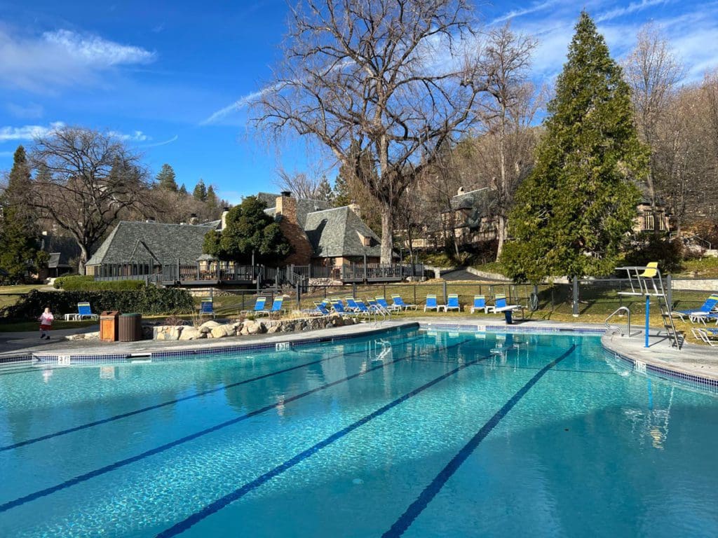 The outdoor swimming pool on a sunny day at UCLA Lake Arrowhead Lodge.