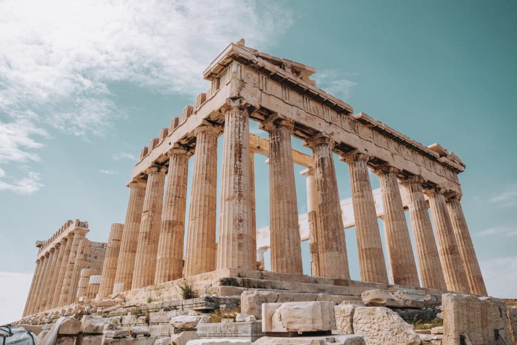 Historic structures at the Parthenon in Athens, Greece, one of the top places in travel in 2023 with kids.