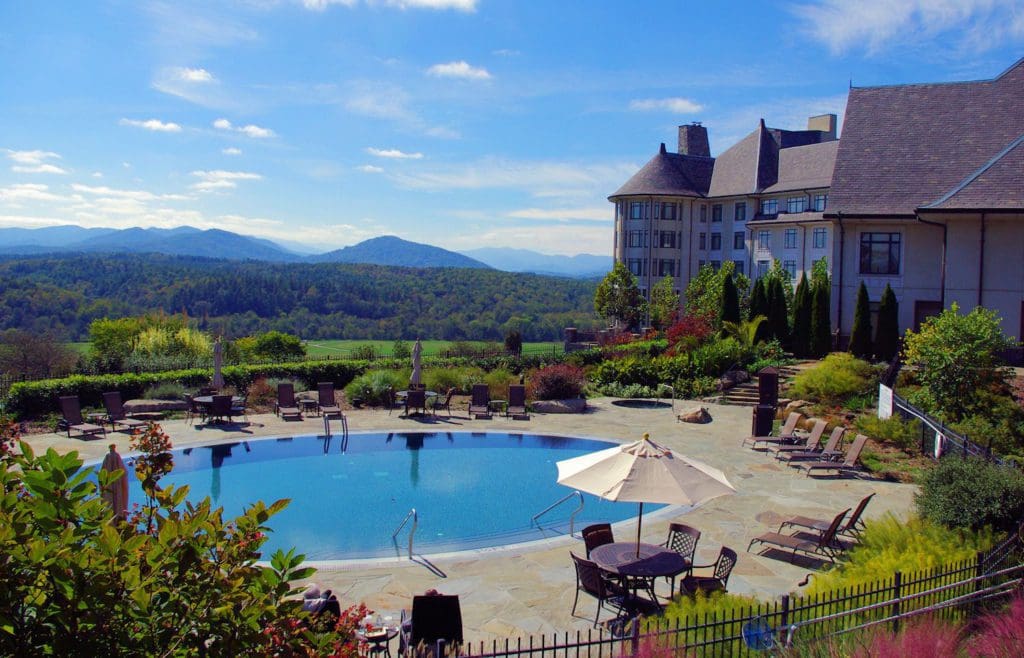 The large outdoor pool and surrounding gardens behind The Inn on Biltmore Estate.