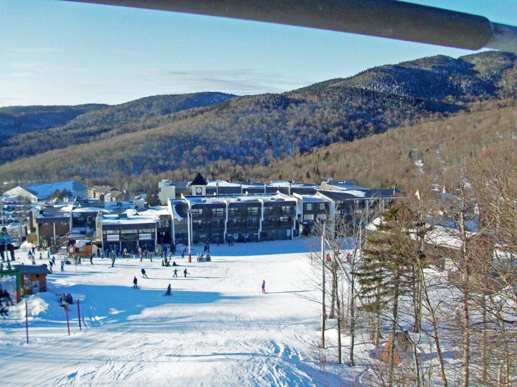 The resort buildings covered in snow at Bolton Valley Resort.