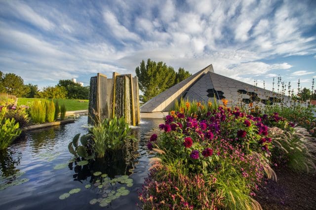 The exterior of the main building, surrounded by gardens, at the Denver Botanic Gardens.