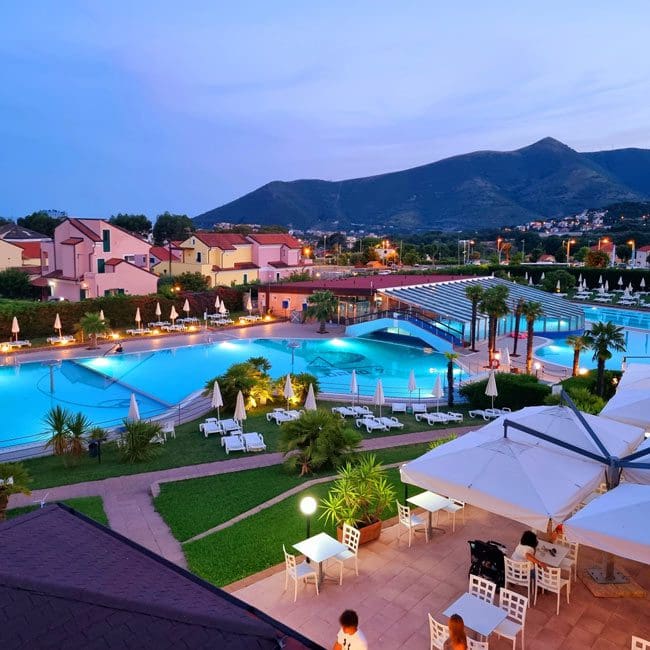 An aerial view of the outdoor pool and resort grounds of Loano 2 Village, one of the best all-inclusive resorts In Italy with kids.
