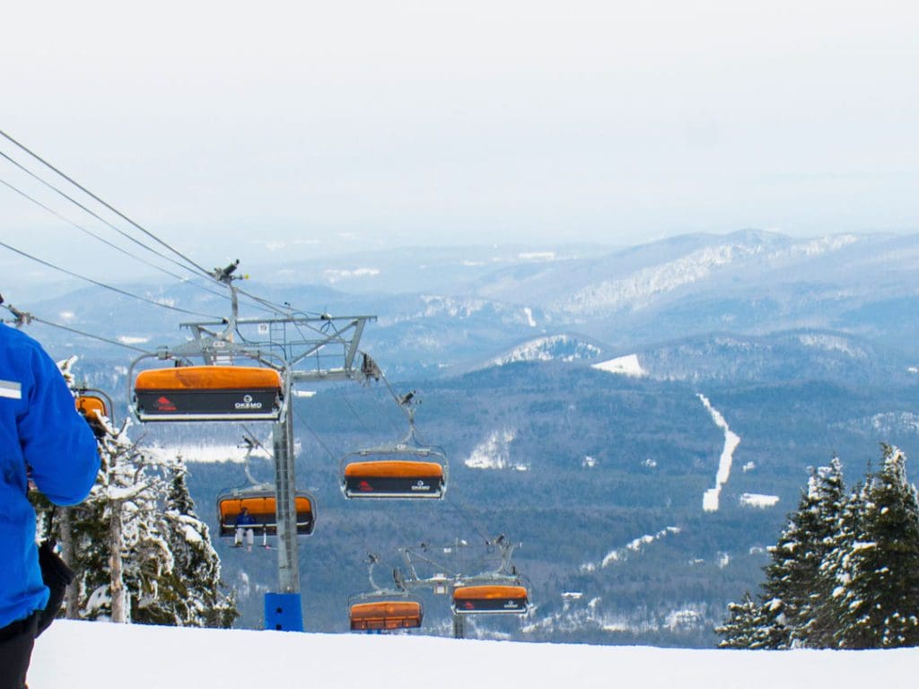 A view of the orange lifts, as well as a fun run at Okemo Mountain Resort.