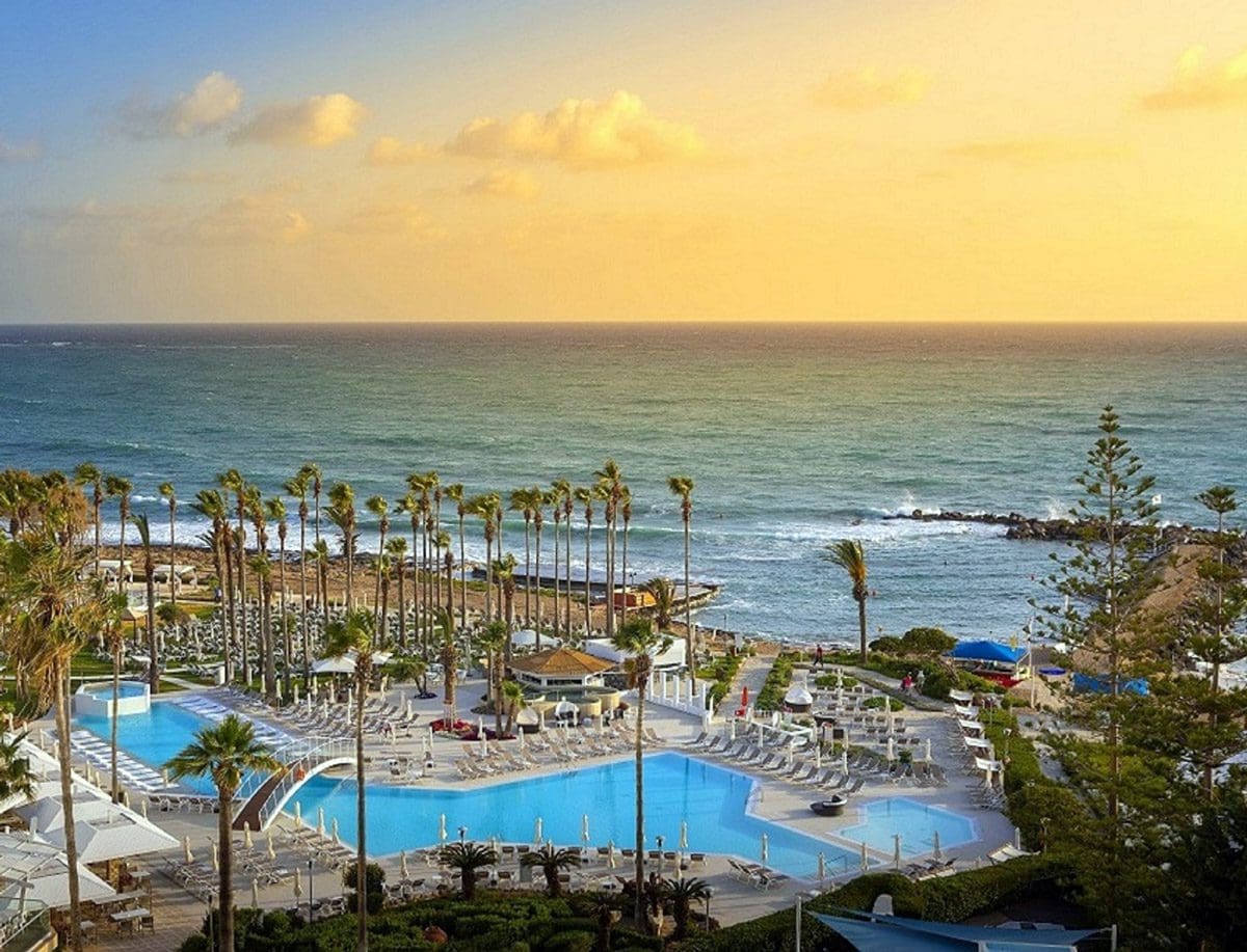 An aerial view of the pool and beach at Leonardo Cypria Bay Hotel.