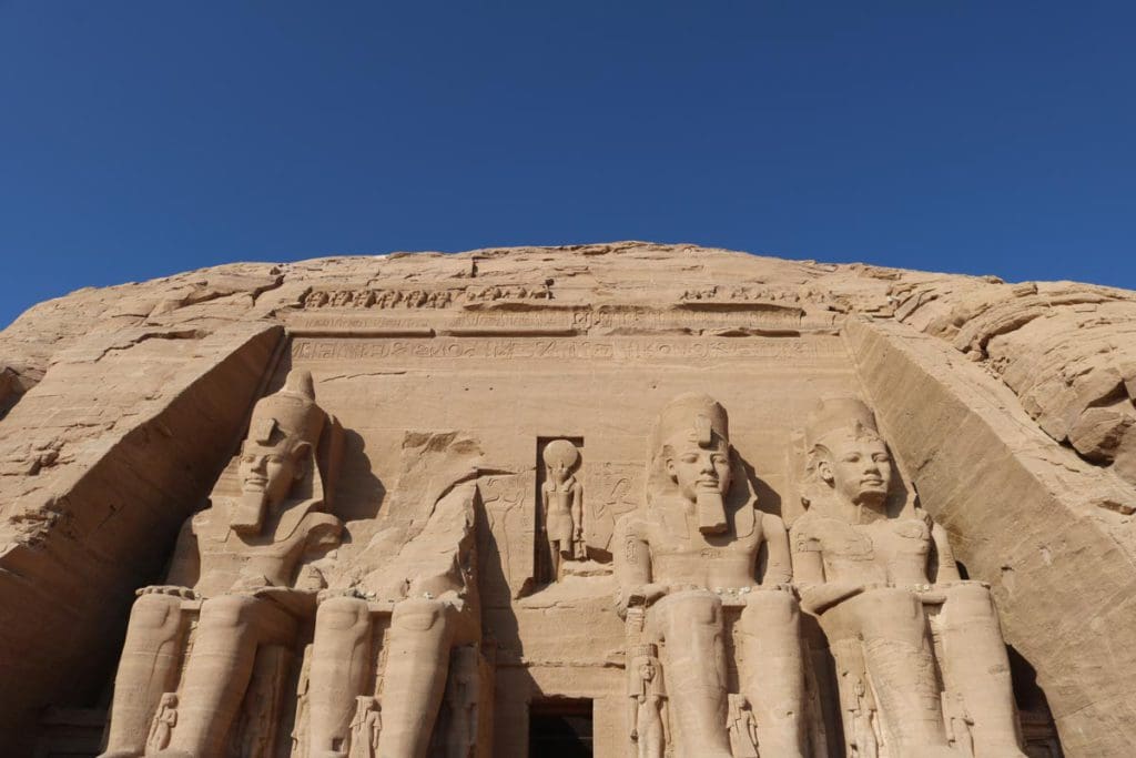 The Pharaoh's of Abu Simbel, a large carved rock structure in Egypt, a must on this 2-Week Egypt Itinerary for Families.