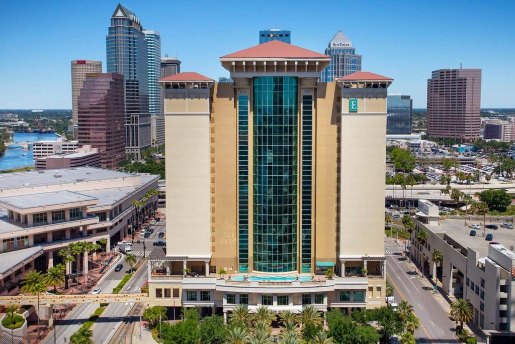 The exterior of Embassy Suites by Hilton Tampa Downtown Convention Center on a sunny day, one of the best hotels in Tampa Bay for families.