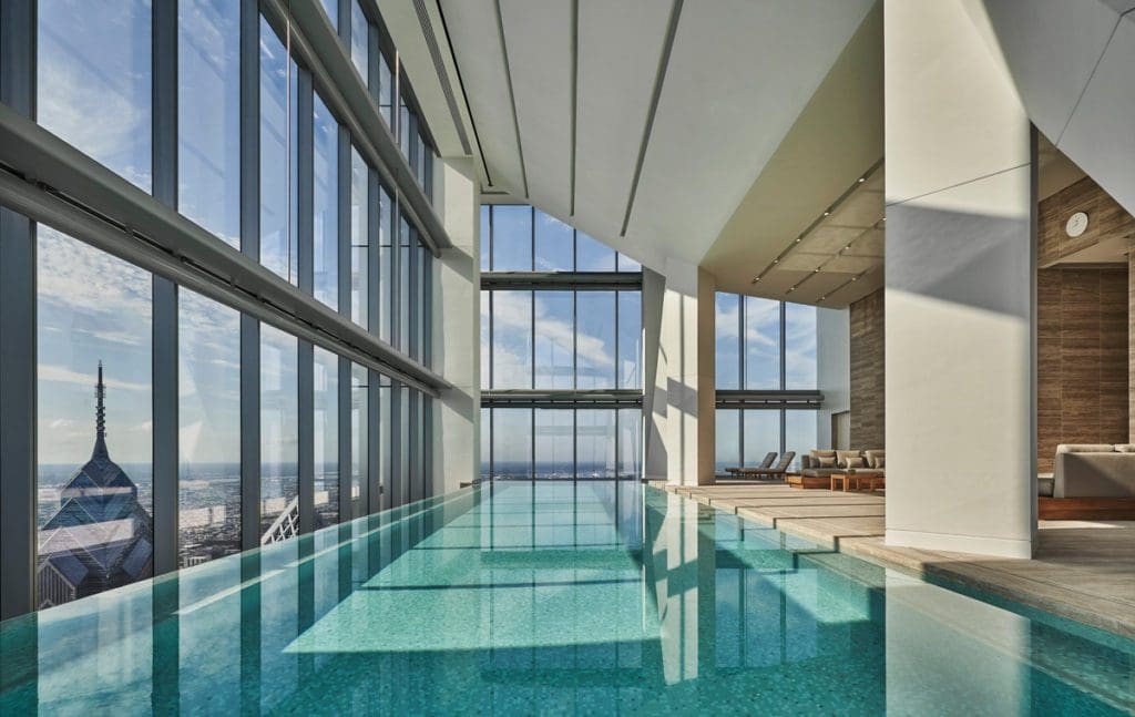 The indoor pool with floor to ceiling windows facing downtown Philly at Four Seasons Hotel Philadelphia at Comcast Center.