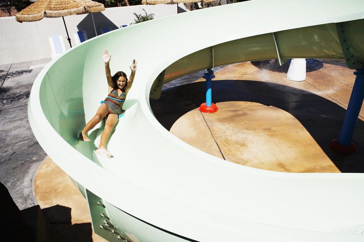 A young girl flies down the waterslide at Howard Johnson Anaheim.