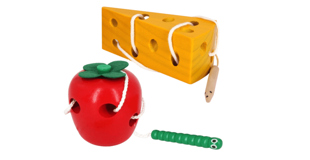 Two SEALIVE toys, one cheese and one apple, with a wooden lacing feature, one of the best travel toys for young kids.