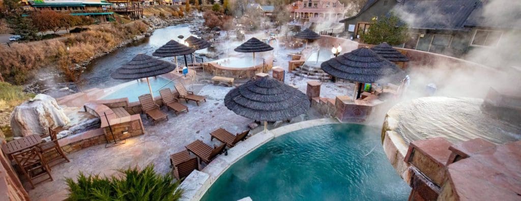 An aerial view of the thermal pools and resort grounds at The Springs Resort & Spa, one of the best hotels for a spa weekend getaway.