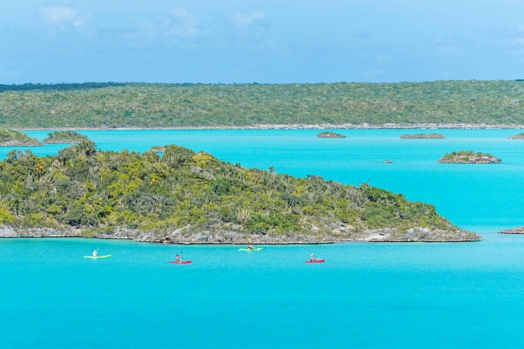 Several kayakers enjoy a tour offshore from Chalk Sound National Park.