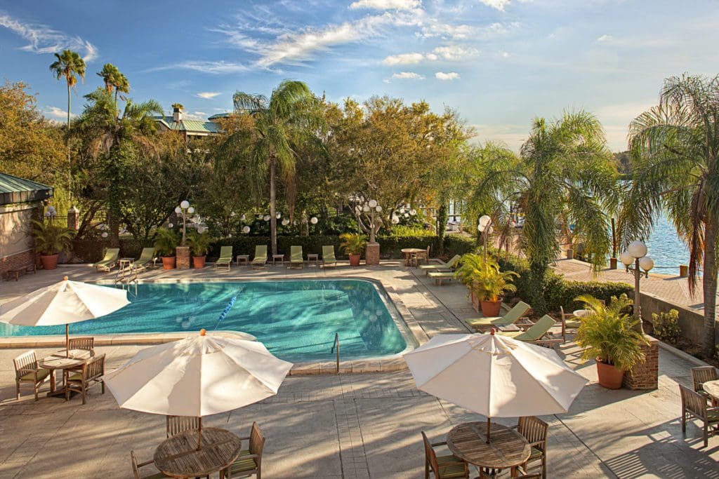 The stunning pool with surrounding greenery, including palm trees, at The Westin Tampa Waterside.