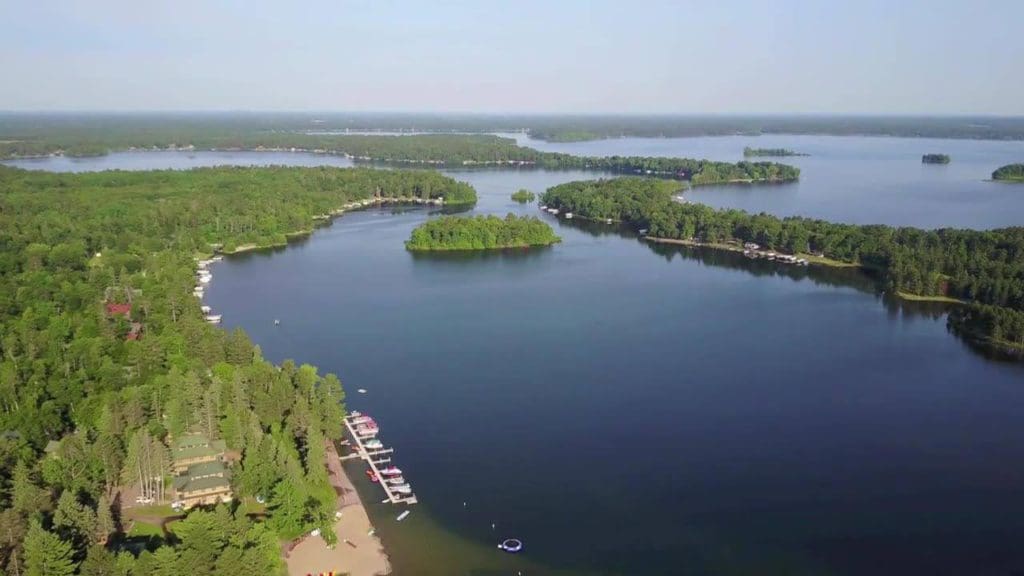 An aerial view of Clamshell Beach Resort nestled along Clamshell Lake.