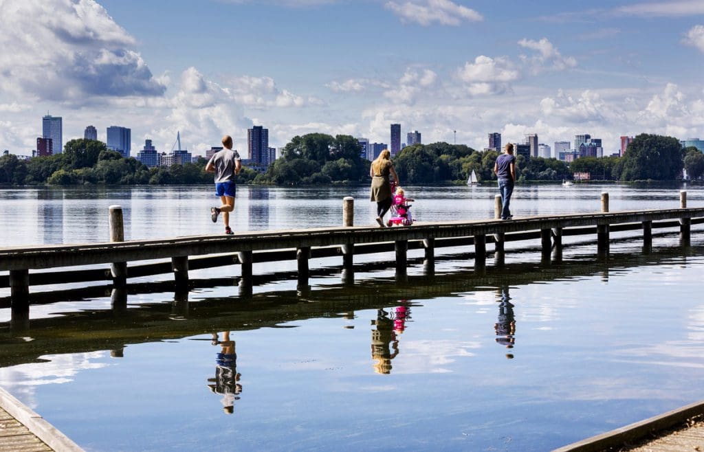 Runners and walkers at the Kralingse Bos in Rotterdam, one of the best places to visit in the Netherlands with kids.