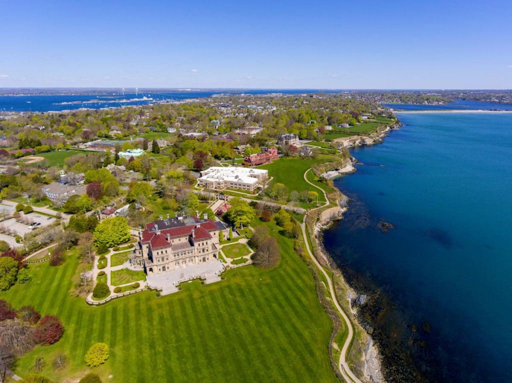 An aerial view of Newport, Rhode Island along the ocean, one of the best places to visit during Memorial Day Weekend near NYC for families.