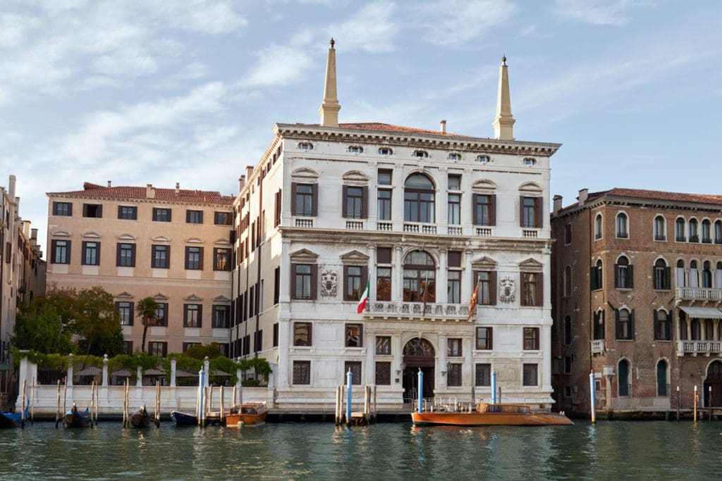 The exterior entrance to Aman Venice along a canal.