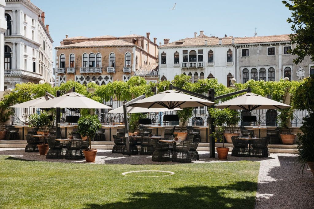 The outdoor garden and patio at Aman Venice.