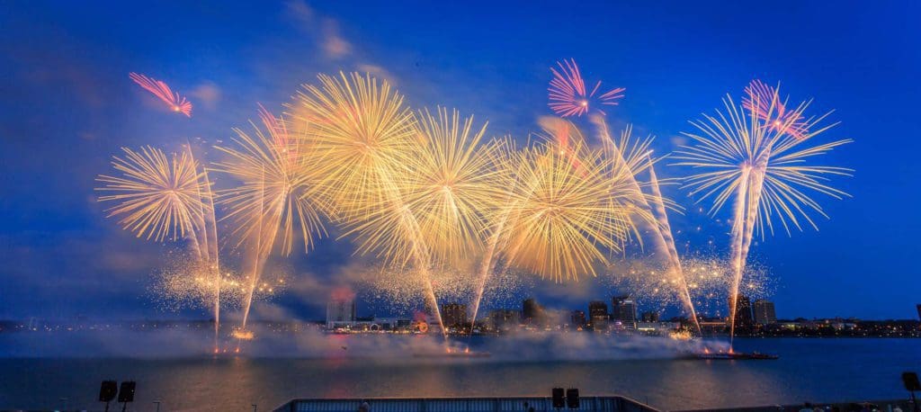 Fire works going off over the city of Detroit on Fourth of July.