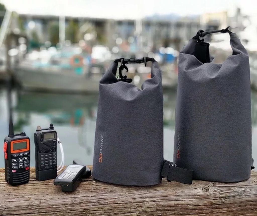 Several Go Dark Bags along a marina railing.