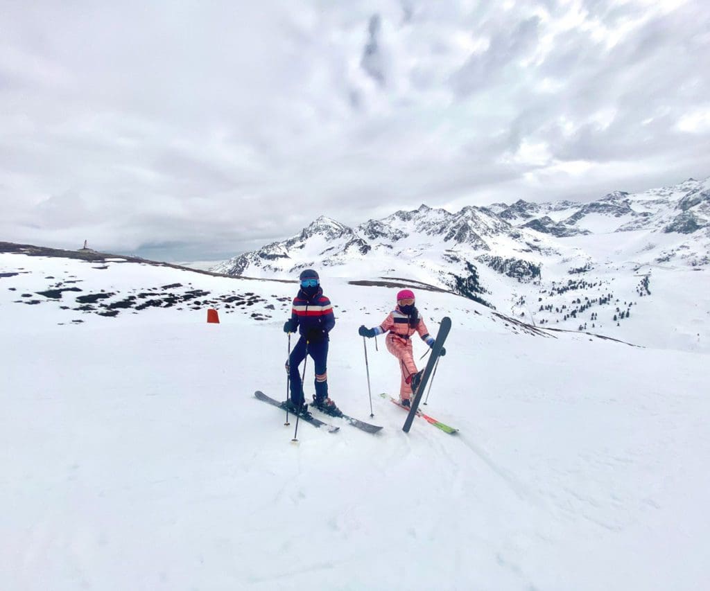 Two kids on skis on the slopes of Kühtai, Austria.