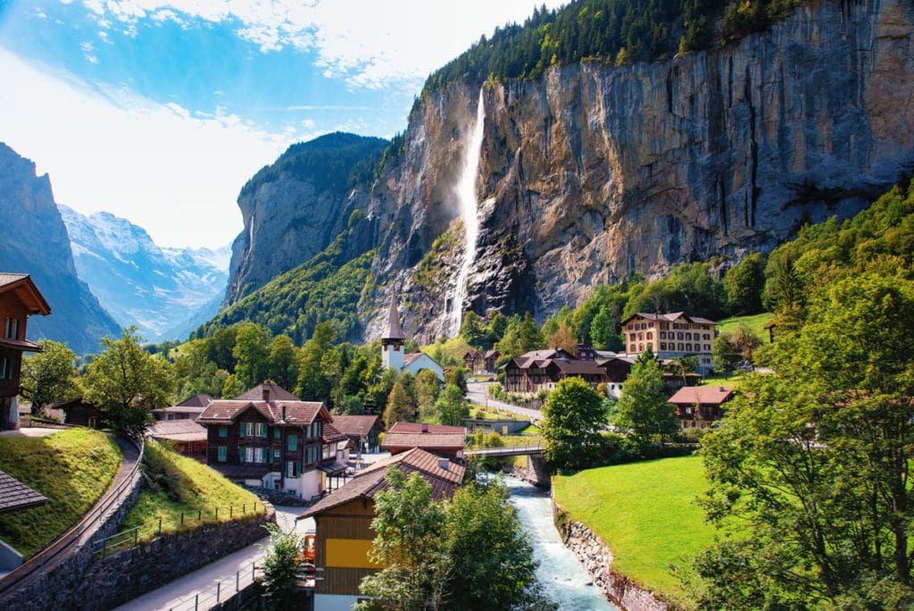 The cozy village of Lauterbrunnen on a sunny day.