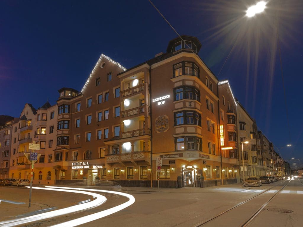 The exterior of Leipziger Hof Innsbruck at night, one of the best places to stay in Innsbruck with kids.