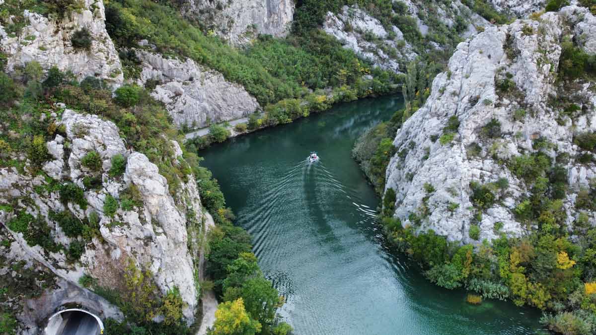 A boat moves down a river near Omis.
