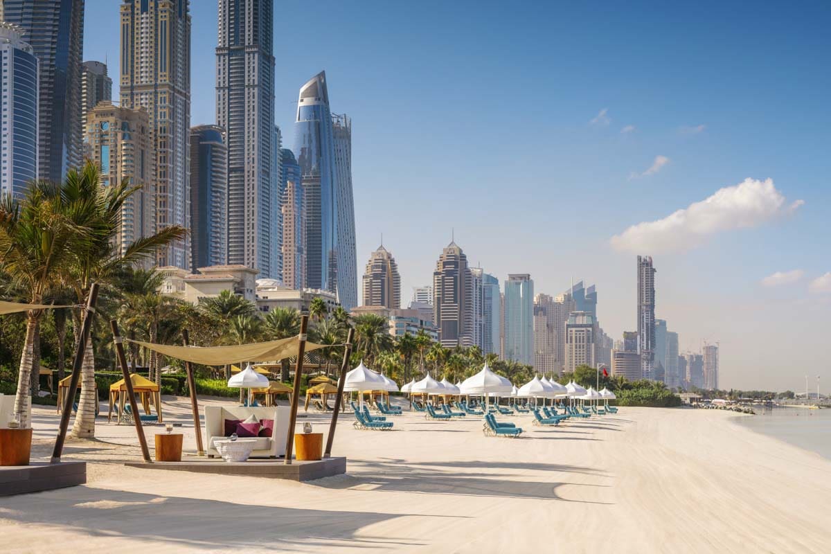 A lovely beach area with cabanas along the ocean at The Palace at One&Only Royal Mirage, one of the best beachfront hotels in Dubai for families.