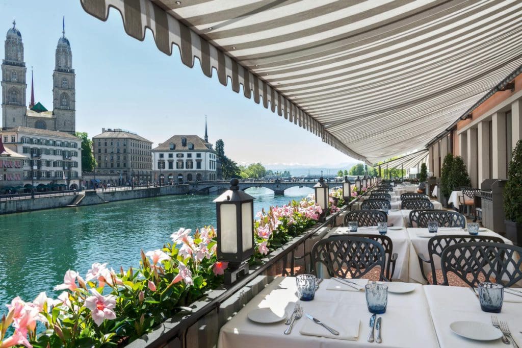 A lovely terrace along Lake Zurich with seating for dinner at Storchen Zurich.