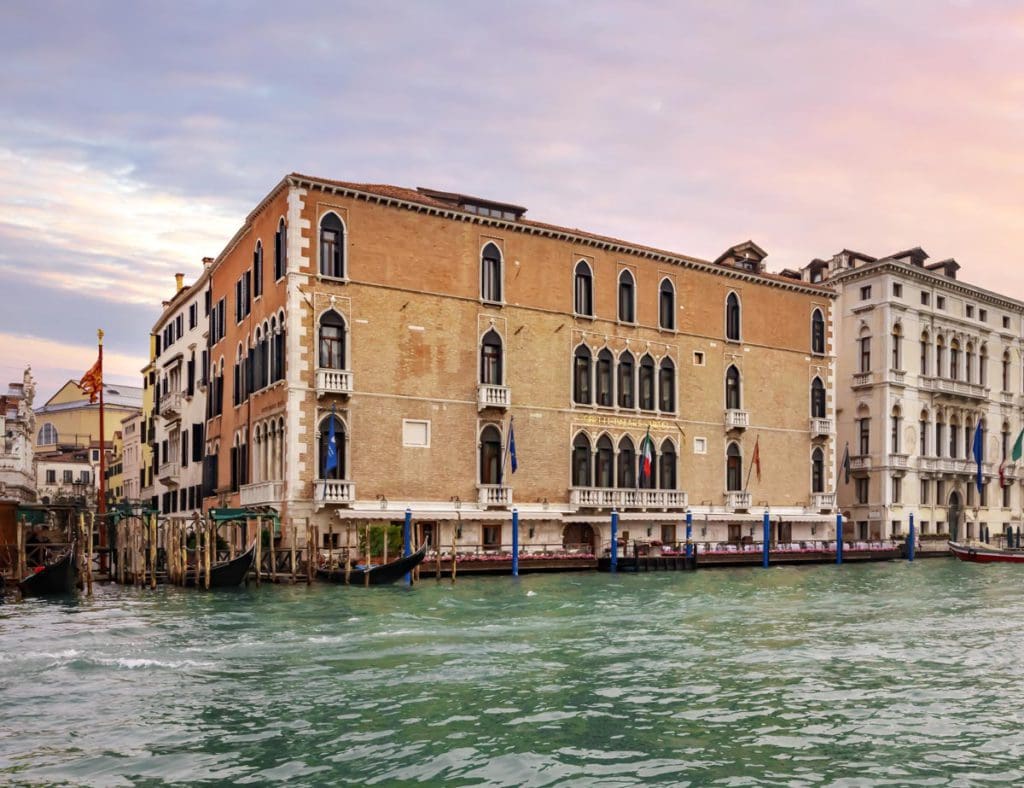 The exterior of The Gritti Palace, a Luxury Collection, set along a canal, one of the best hotels in Venice for families.