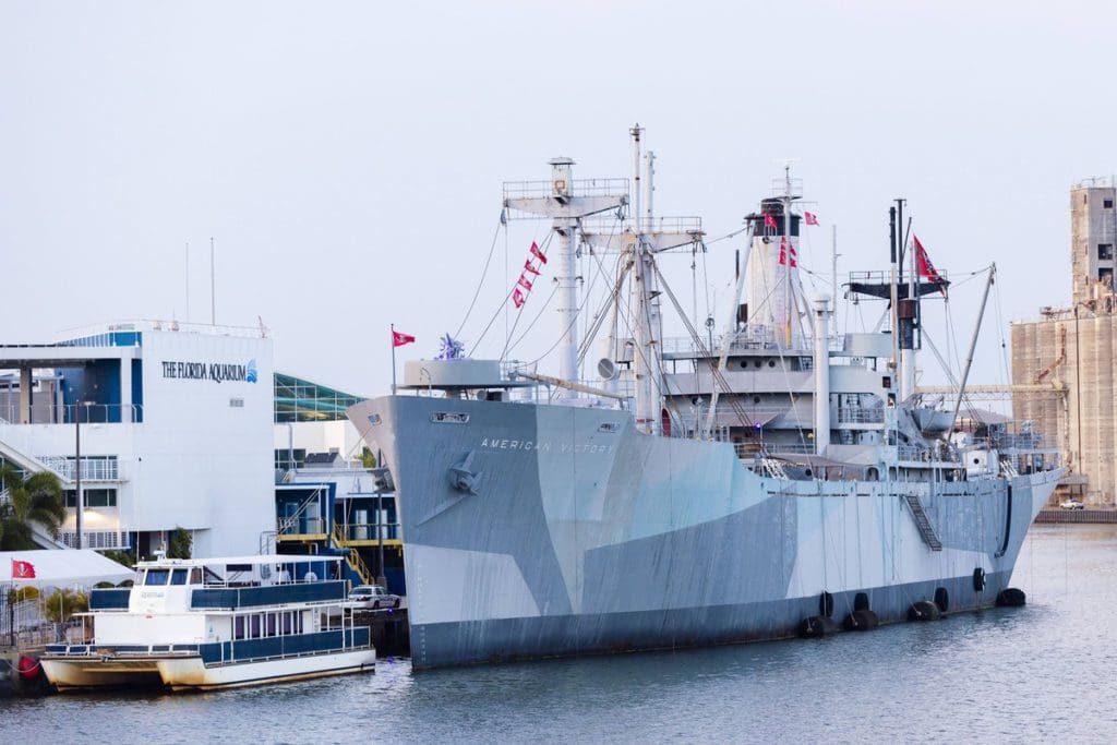 The American Victory Ship Mariners Museum anchored in port.