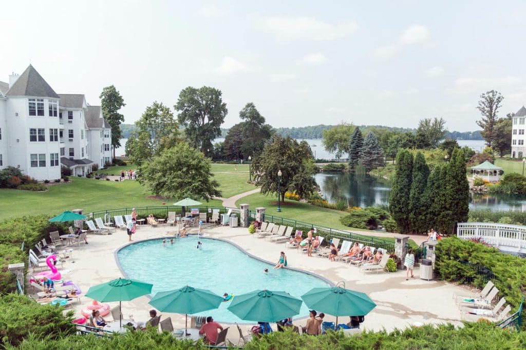The outdoor pool and surrounding garden area at The Osthoff Resort, one of the best Moms Weekend Getaways in the Midwest.