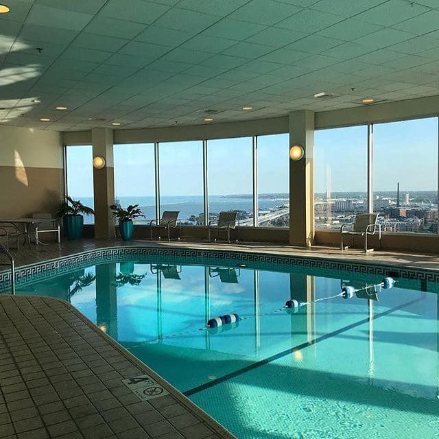 The indoor pool at The Pfister Hotel with a view of downtown Milwaukee. 