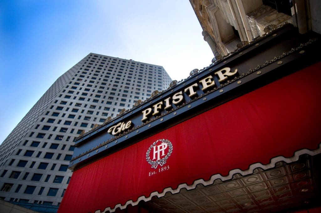 The exterior signage at The Pfister Hotel, one of the best Moms Weekend Getaways in the Midwest.