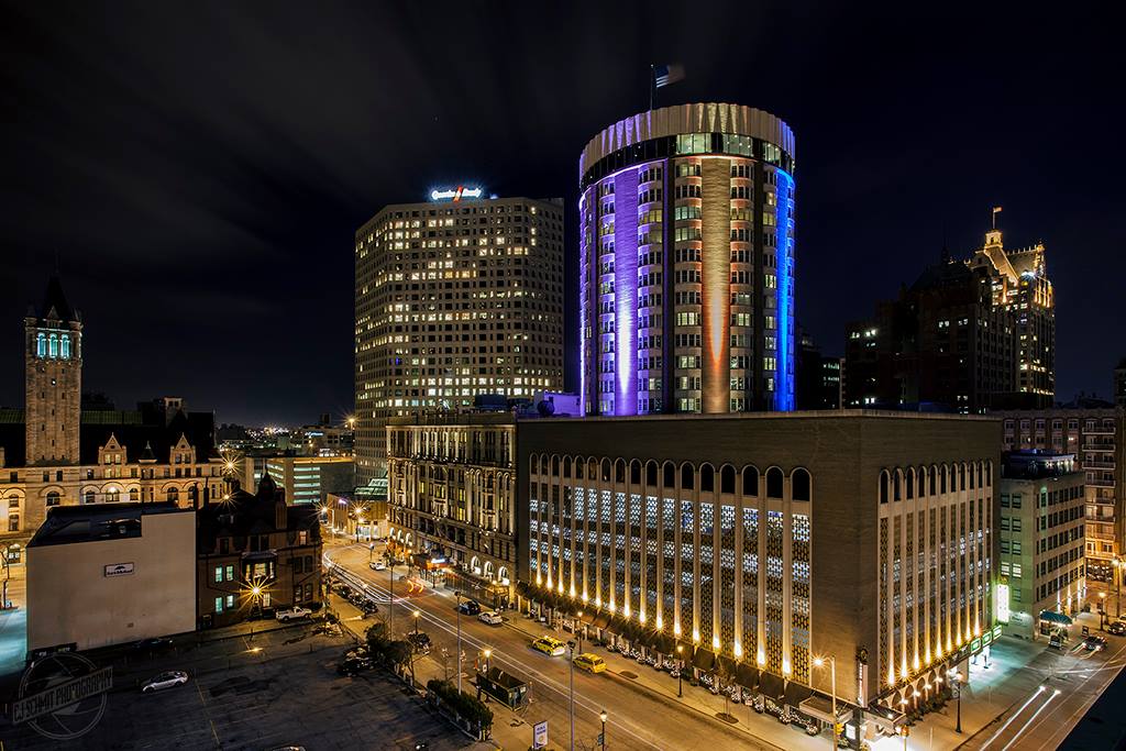 The exterior of The Pfister Hotel at night, one of the best Moms Weekend Getaways in the Midwest.