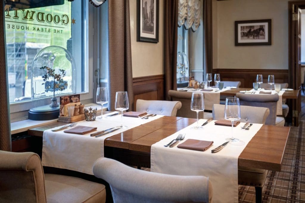 A table set for dinner service at the on-site restaurant at ALDEN Suite Hotel Splügenschloss Zurich.