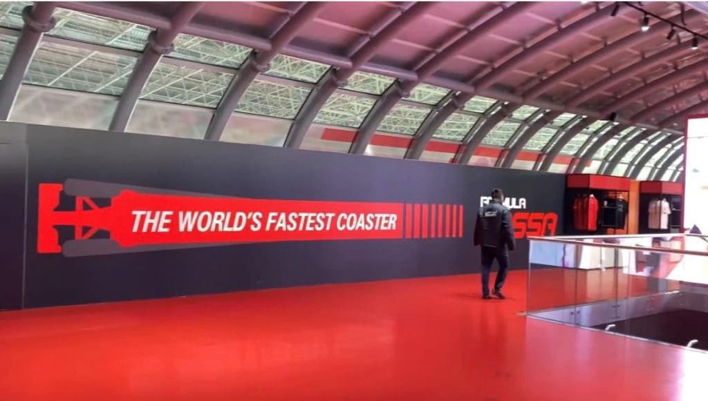 A sign in Ferrari World on Yas Island reading "The World's Fastest Coaster".