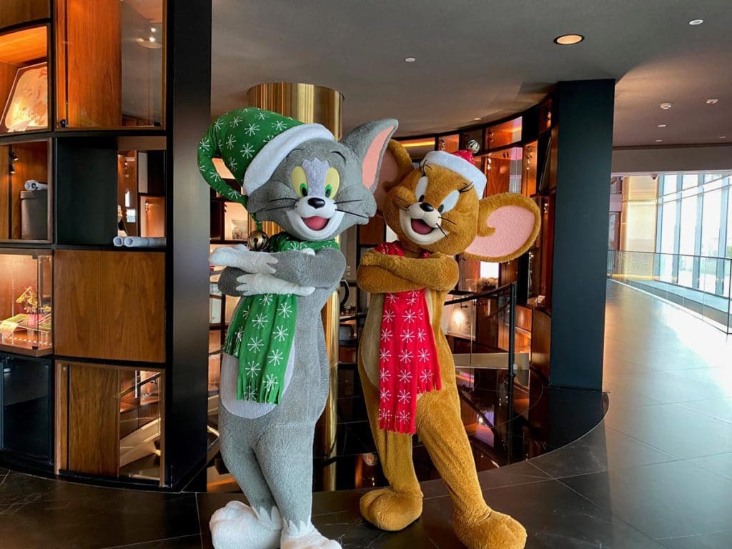 Two Warner Bros. cartoon mice mascots dressed for Christmas on Yas Island.