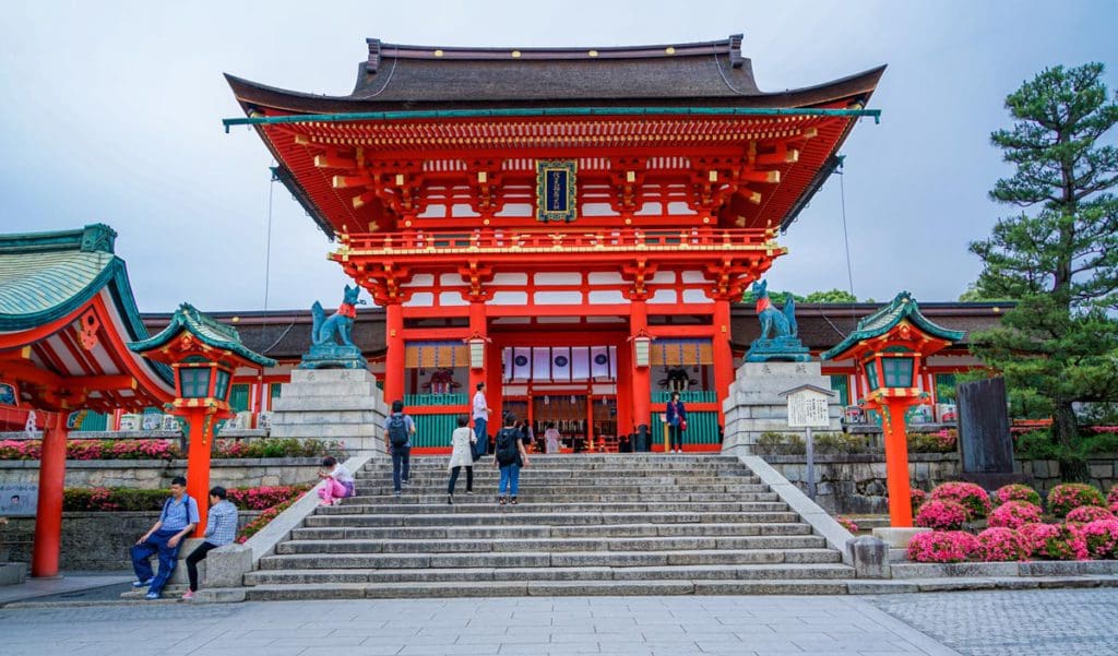 People climb the stairs of a temple in Kyoto, Japan.