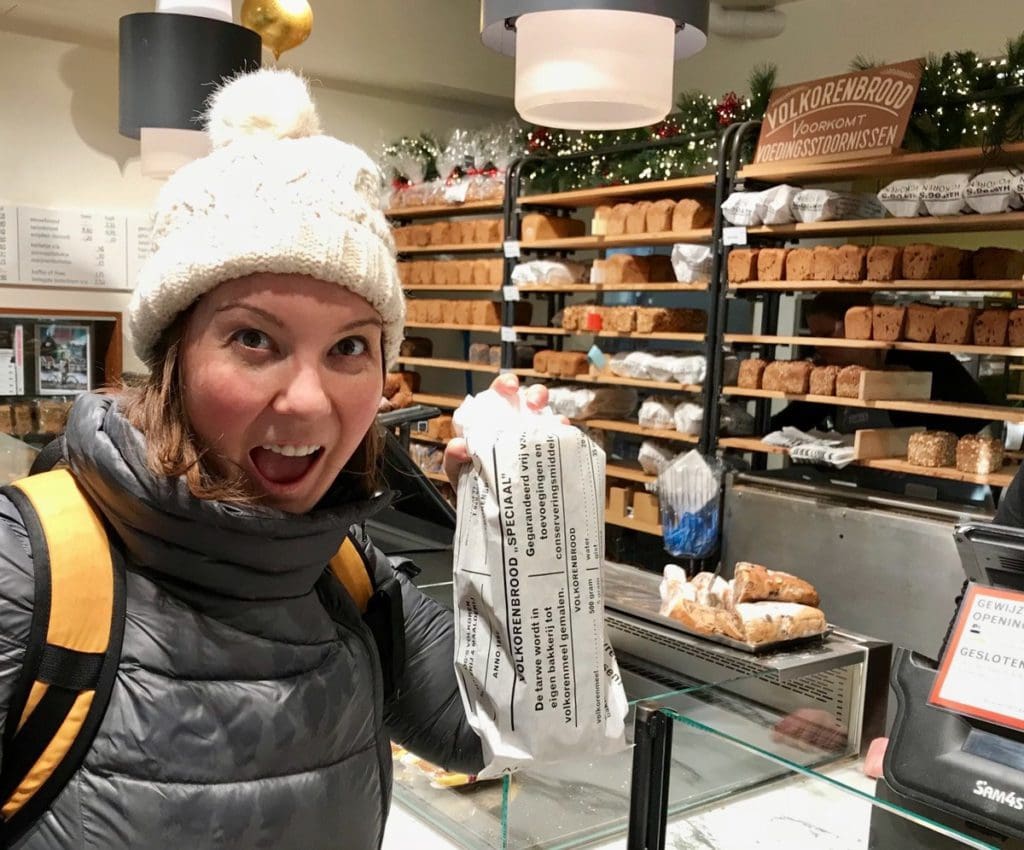 A woman enjoys a new treat, while on a biking experience around Amsterdam with kids.