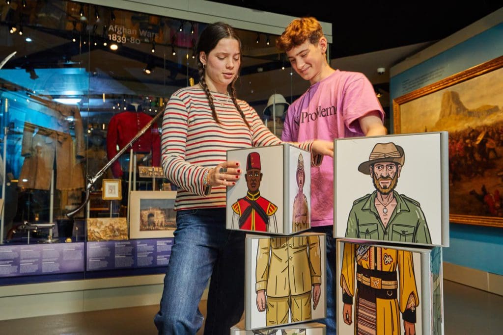 Two teens look at an exhibit at National Army Museum.