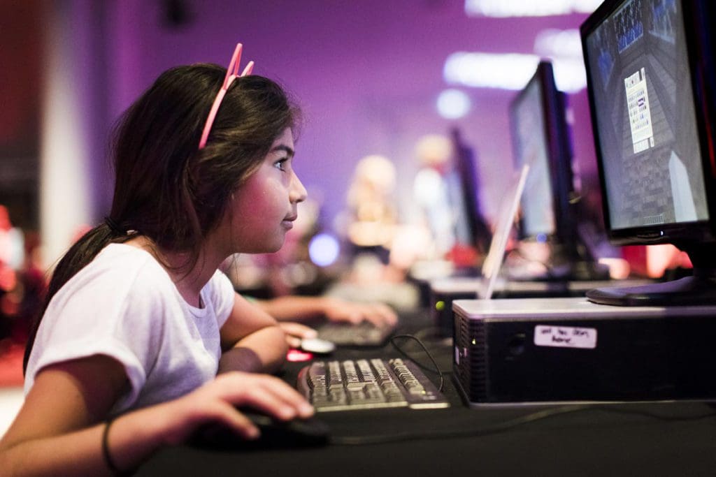 A young girls plays at an exhibit station at The Science Museum, one of the best museums in London for kids.