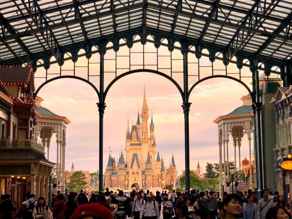 A view of the princess castle at Disneyland Tokyo through the grand entrance, a must-stop on any Tokyo itinerary with kids.