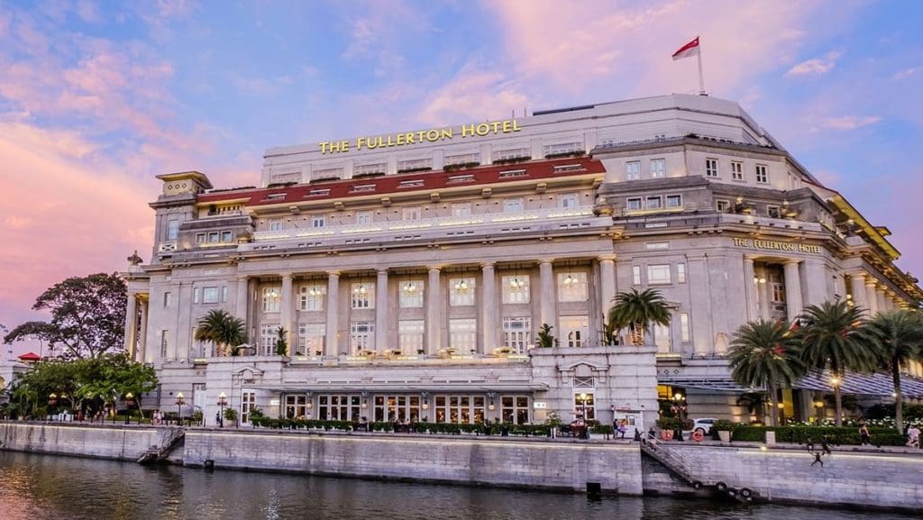 The exterior entrance to Fullerton Bay Hotel at dusk.